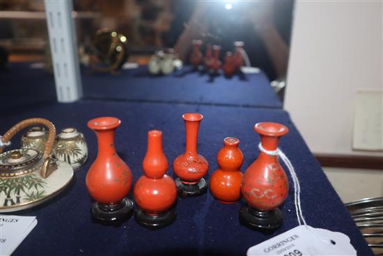 A group of four Chinese lacquer wood miniature vases and a similar pottery double gourd vase (5)